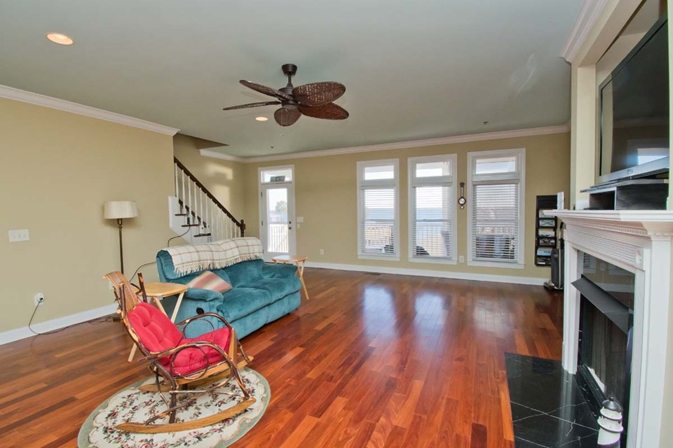 living room beautiful view of bogue sound, fireplace and hardwood floors. on 2nd level