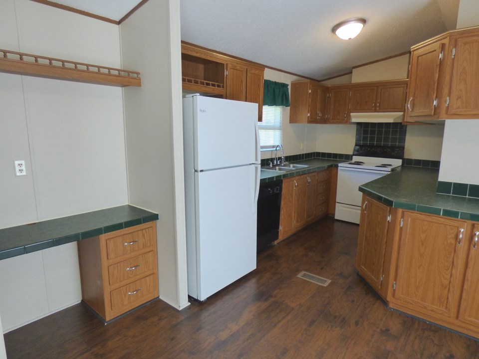 kitchen - new stove has been added (old one in pic) remodel also includes new doors on the lower kitchen cabinets.