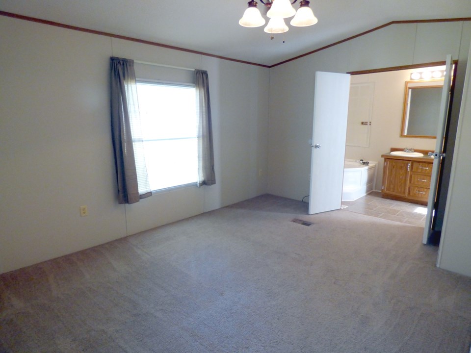 master bedroom has new carpet, similar color