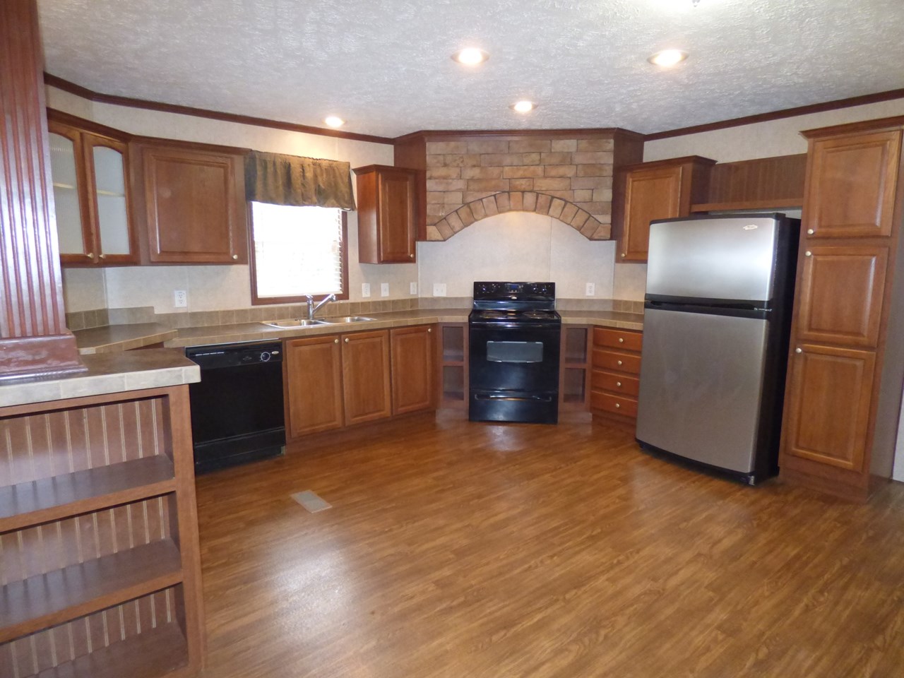 has new hickory laminate floors, new stainless stove.