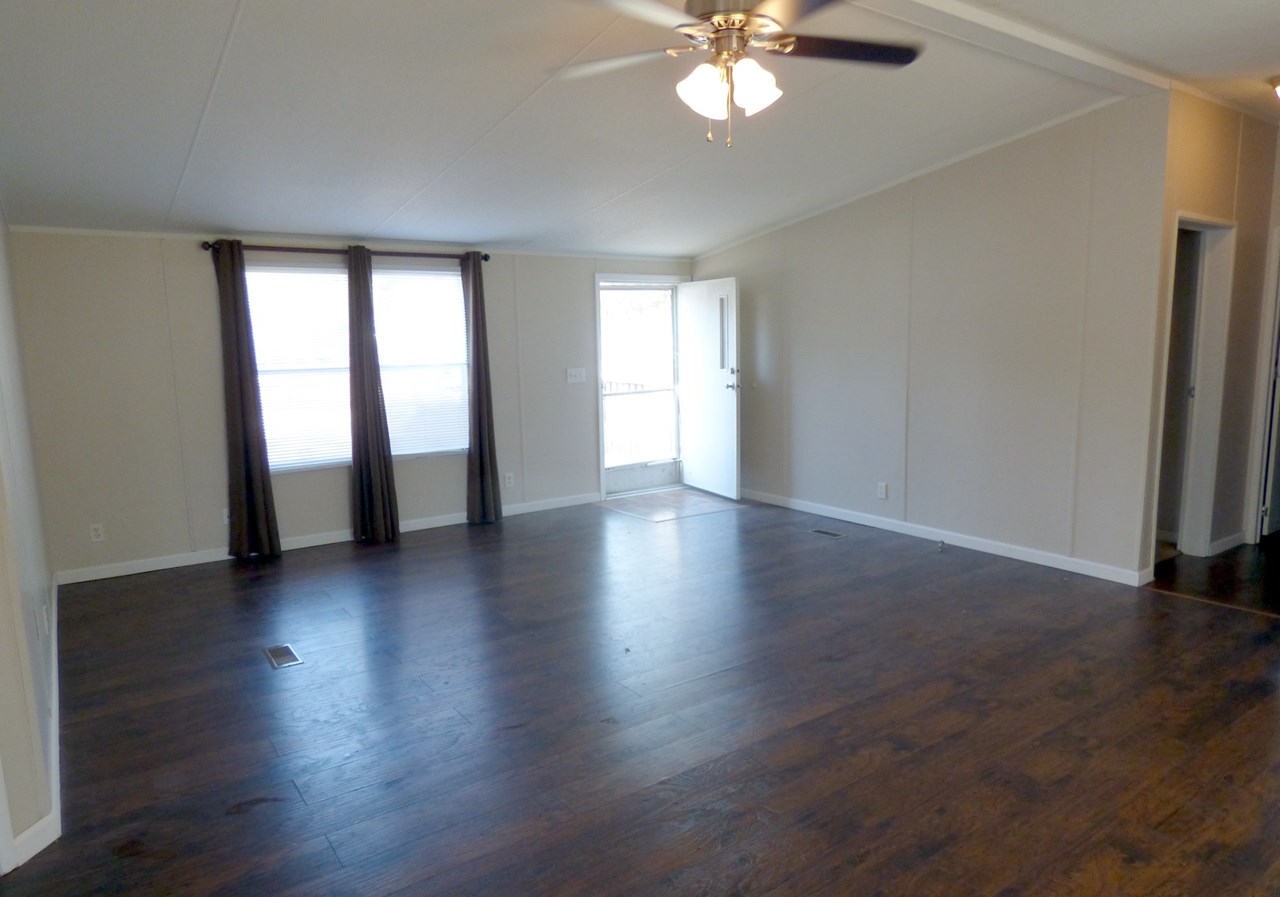 living room with hickory laminate floors approx measurements 19' x 16'6